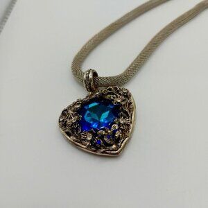 Vintage puffed heart locket necklace with blue crystal stone and floral details